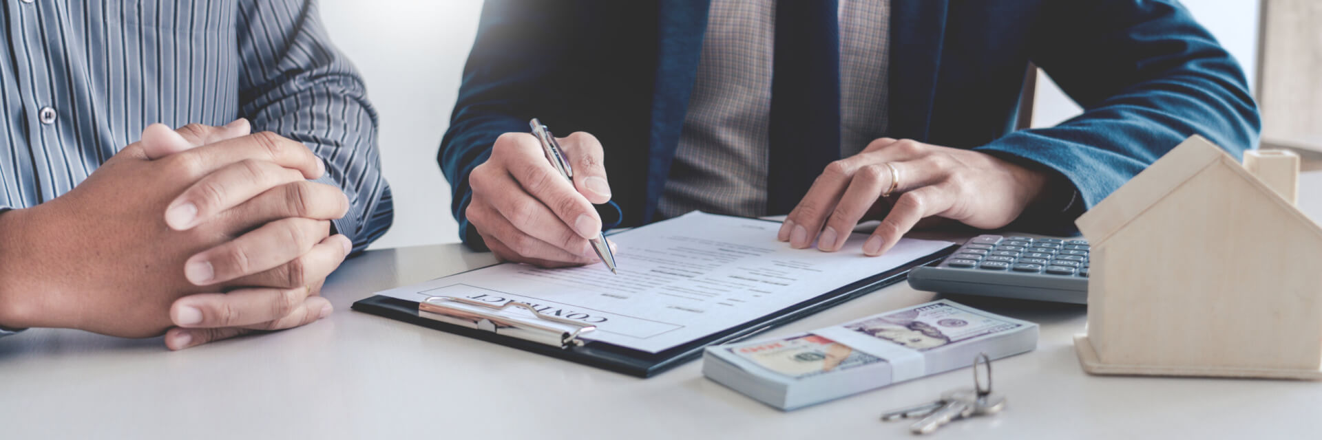 Real estate agents explain the document for customers who come to contact to buy a house, buy or sell real estate concept